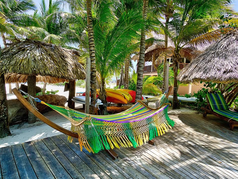 Kayaks on rack and hammock on a deck at Xanadu