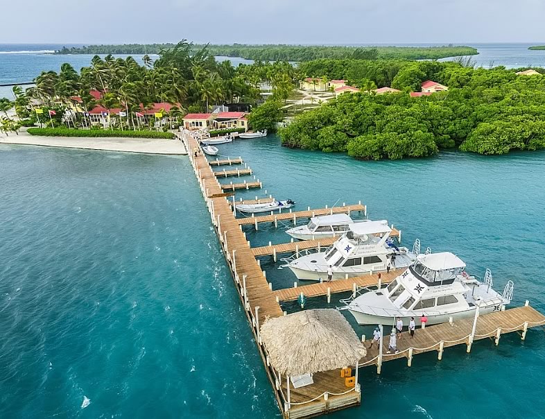Turneffe Island Resort Pier with docked boats