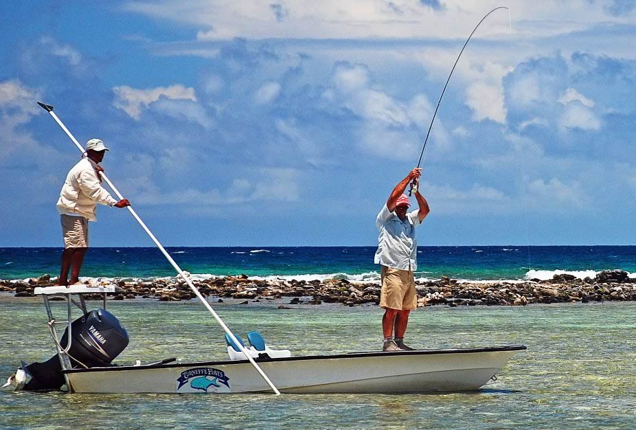 Two divers pose for an underwater picture at the Belize Barrier reef