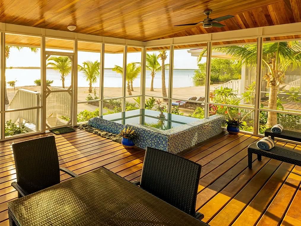 Interior of the Sunset Villa at Turneffe Resort overlooking the lagoon