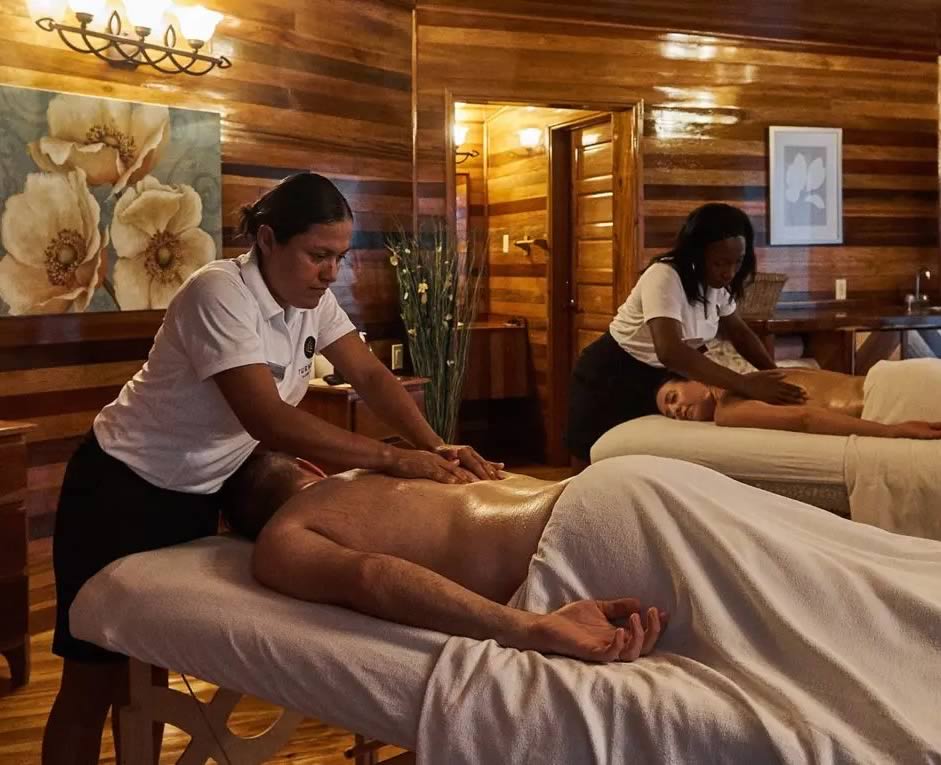 Two people on beds getting spa treatment