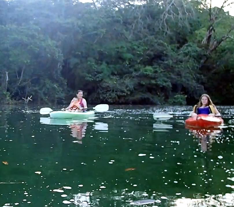 Two kayakers in the river