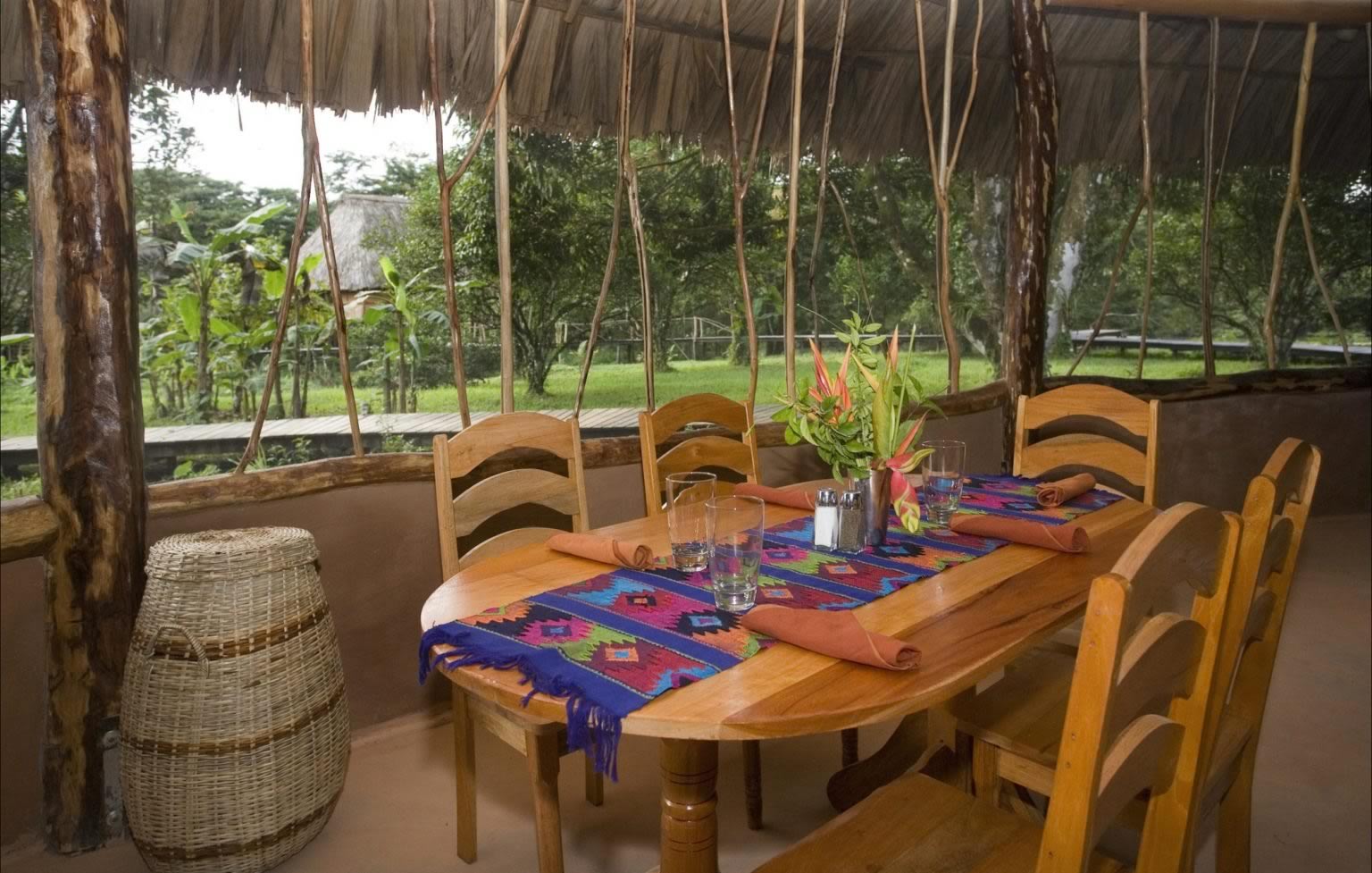 Cotton Tree Restaurant Table with view of the lawn and garden outside