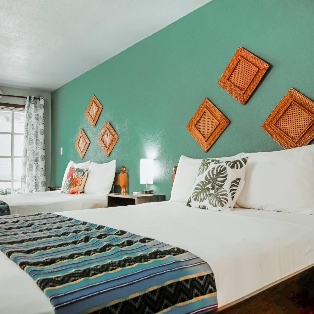 Interior of a bedroom with a king and single bed