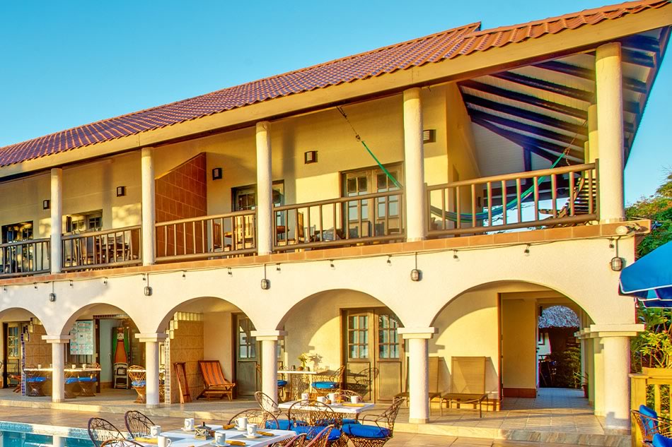 The light yellow main building at Mariposa Resort