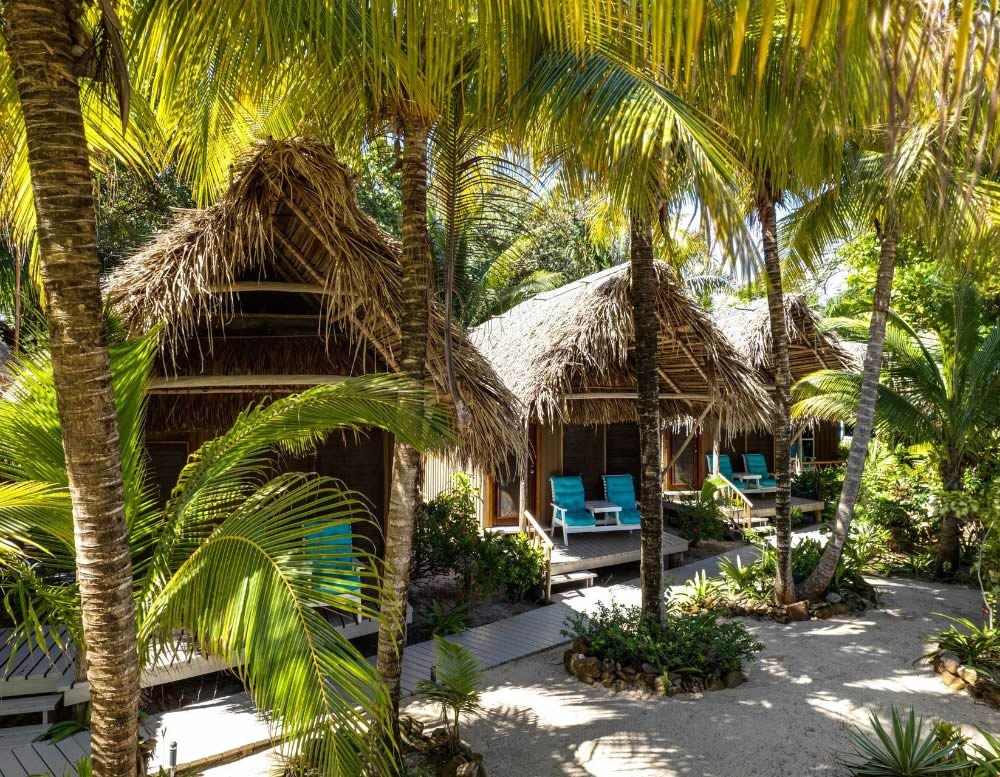 Private garden cabanas with porch and chairs
