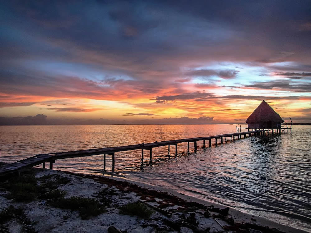 Family overwater cabin at sunset