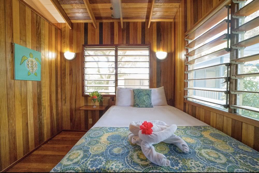 Interior of a rustic style villa with bed ahd hardwood