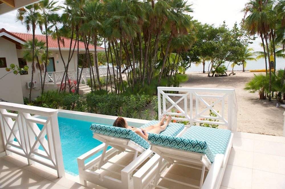Woman relaxing in a chaise lounge at the poolside