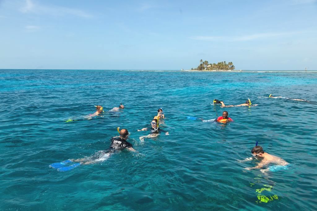 People in the turquoise water snorkeling