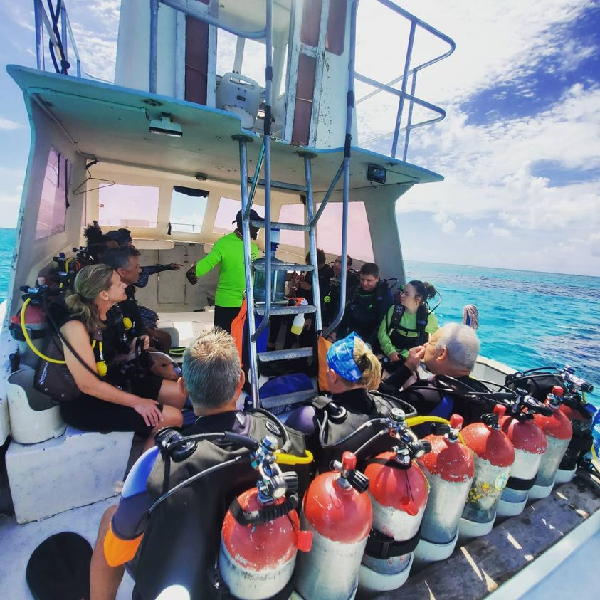 Dive instructor briefing divers on a whale shark diving trip