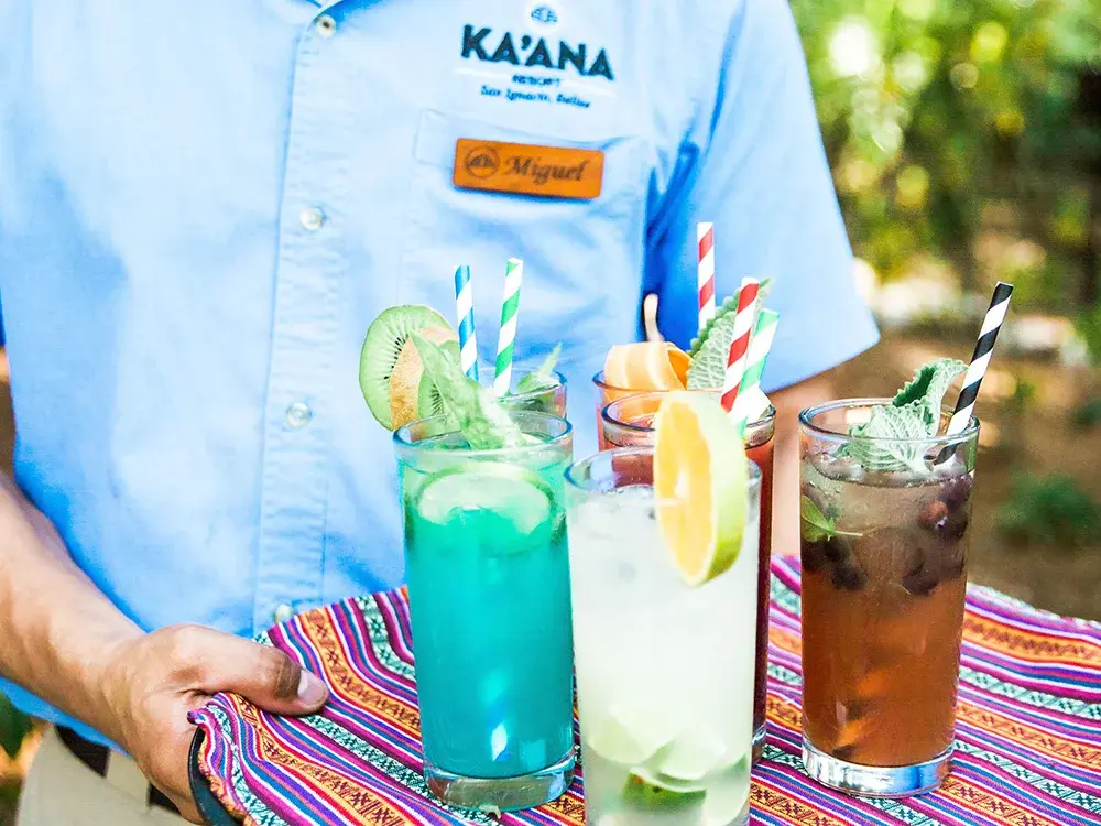 Waiter serving cocktails