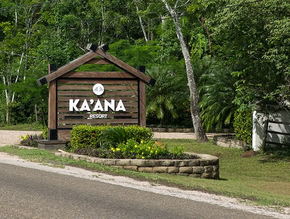 Wooden sign entrance to Kaana Resort