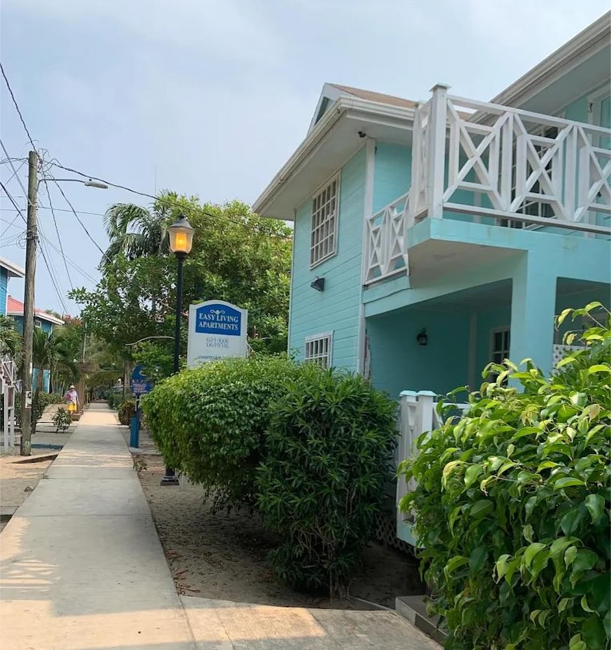 Easy Living Apartments alongside Placencia Village, cement walk