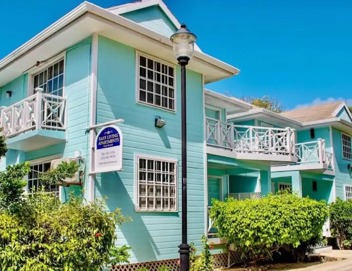 View of Easy Living Guesthouse along the Placencia sidewalk