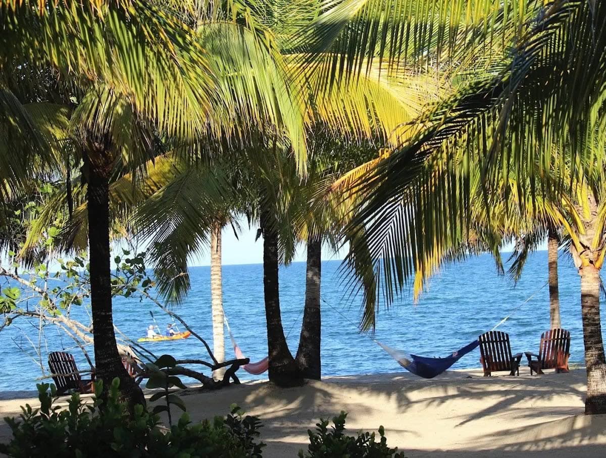 Two people kayaking in front of the resort